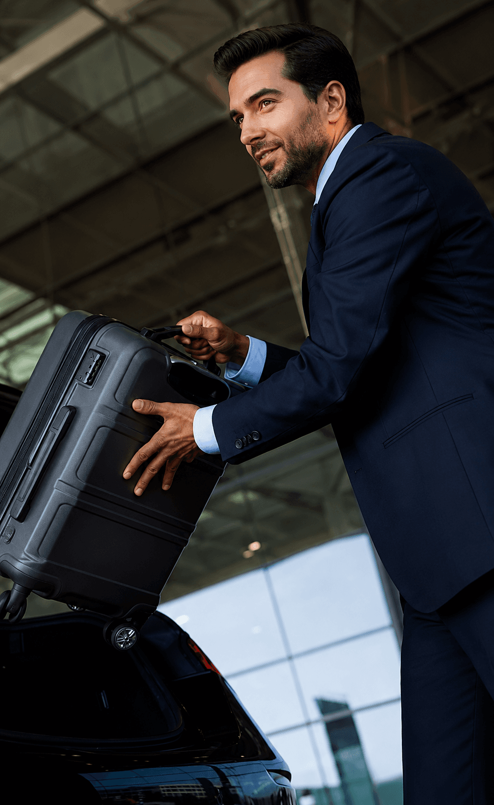 Chauffeur assisting guests at an airport transfer pickup